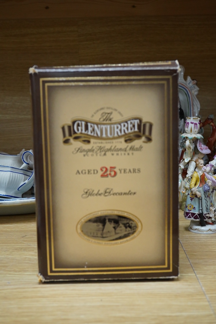 A boxed bottle of Glenturret single highland malt whisky, housed in a globe decanter